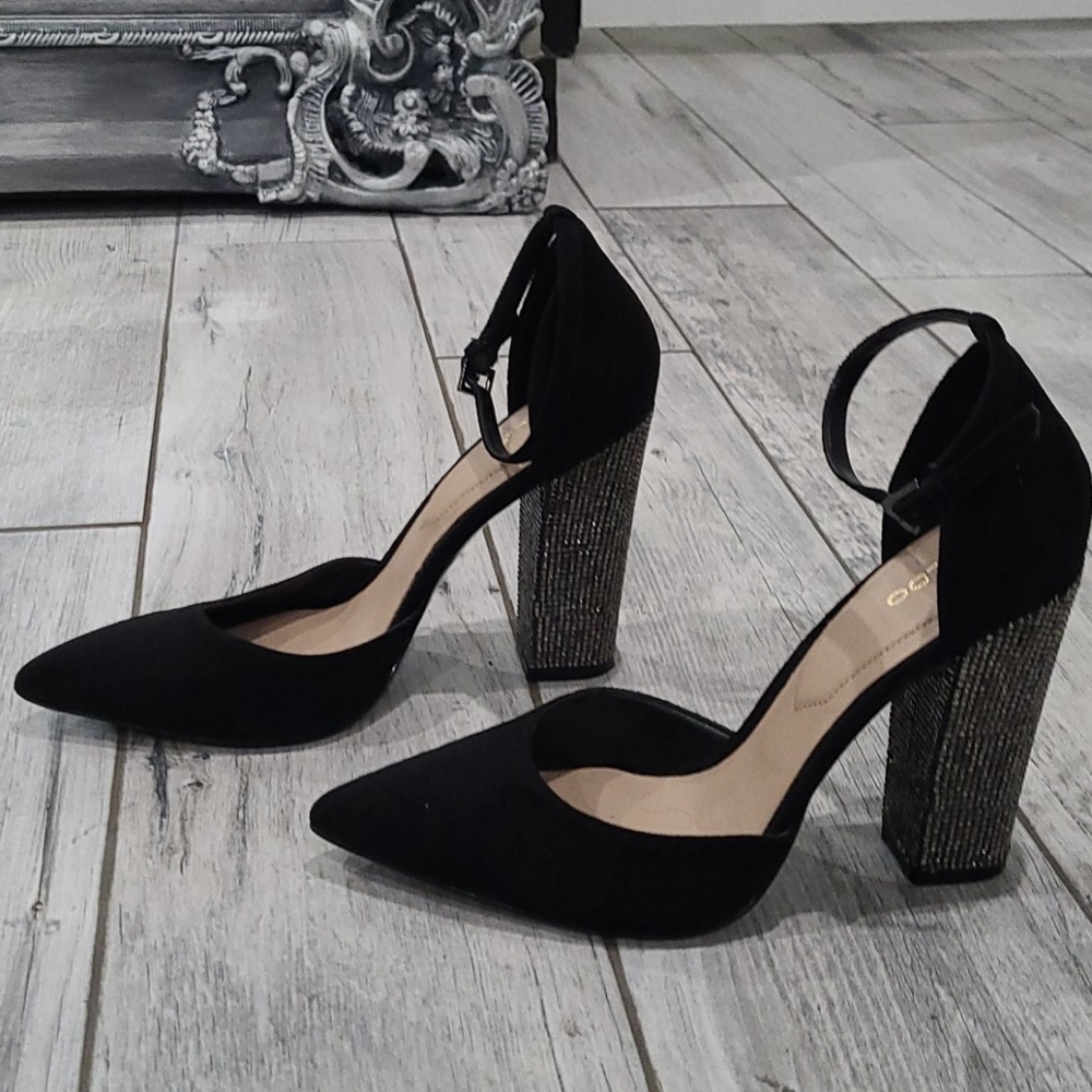 Black crystal pumps.
